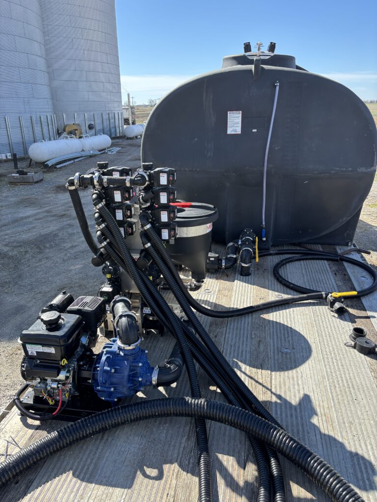 Mixmate Fusion Inductor and 6 Input Flow Stack with John Blue poly 3 inch water pump installed on aluminum deck over semi trailer.